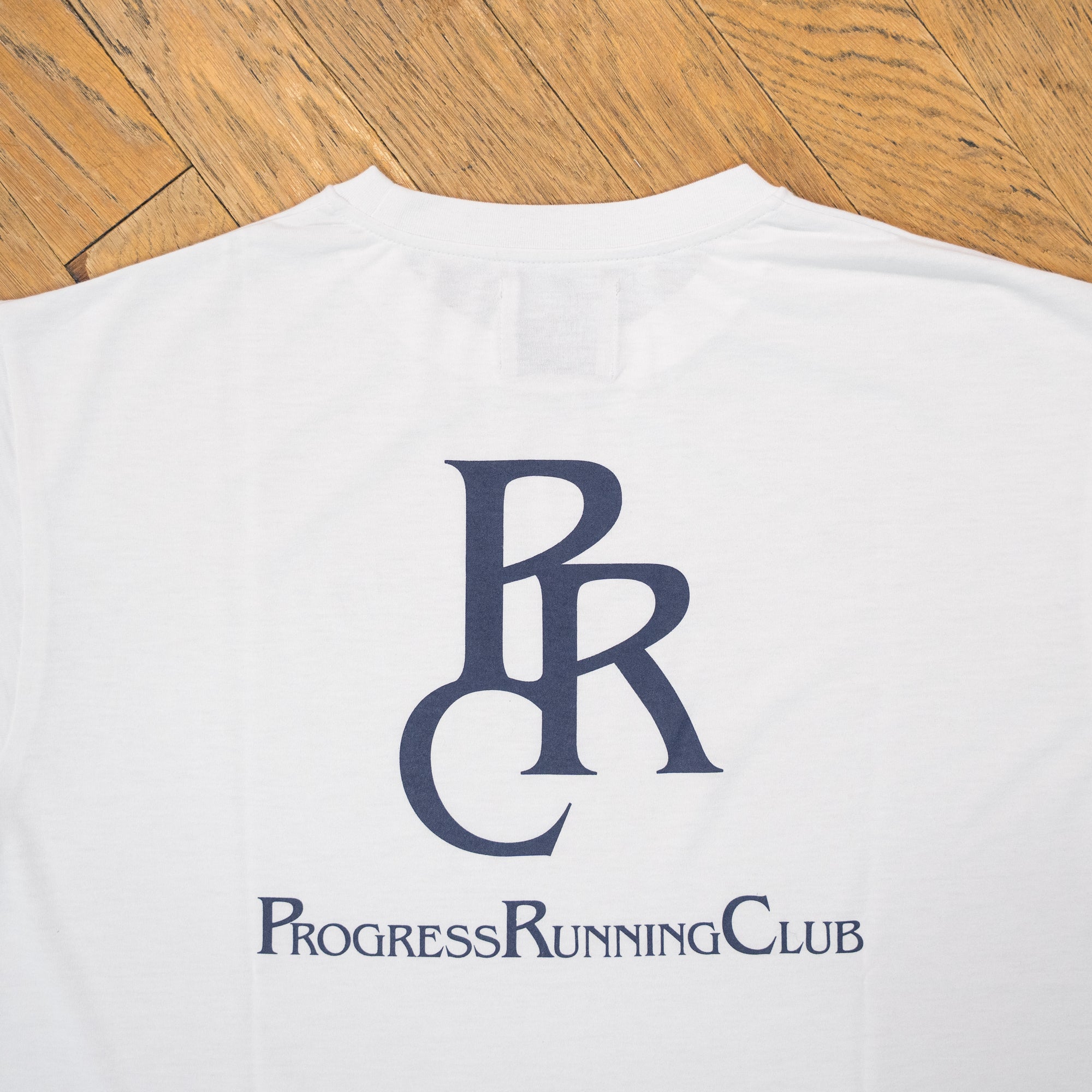 Runtrip × PROGRESS RUNNING CLUB "PRC BADGE LOGO" Rt Logo Tee