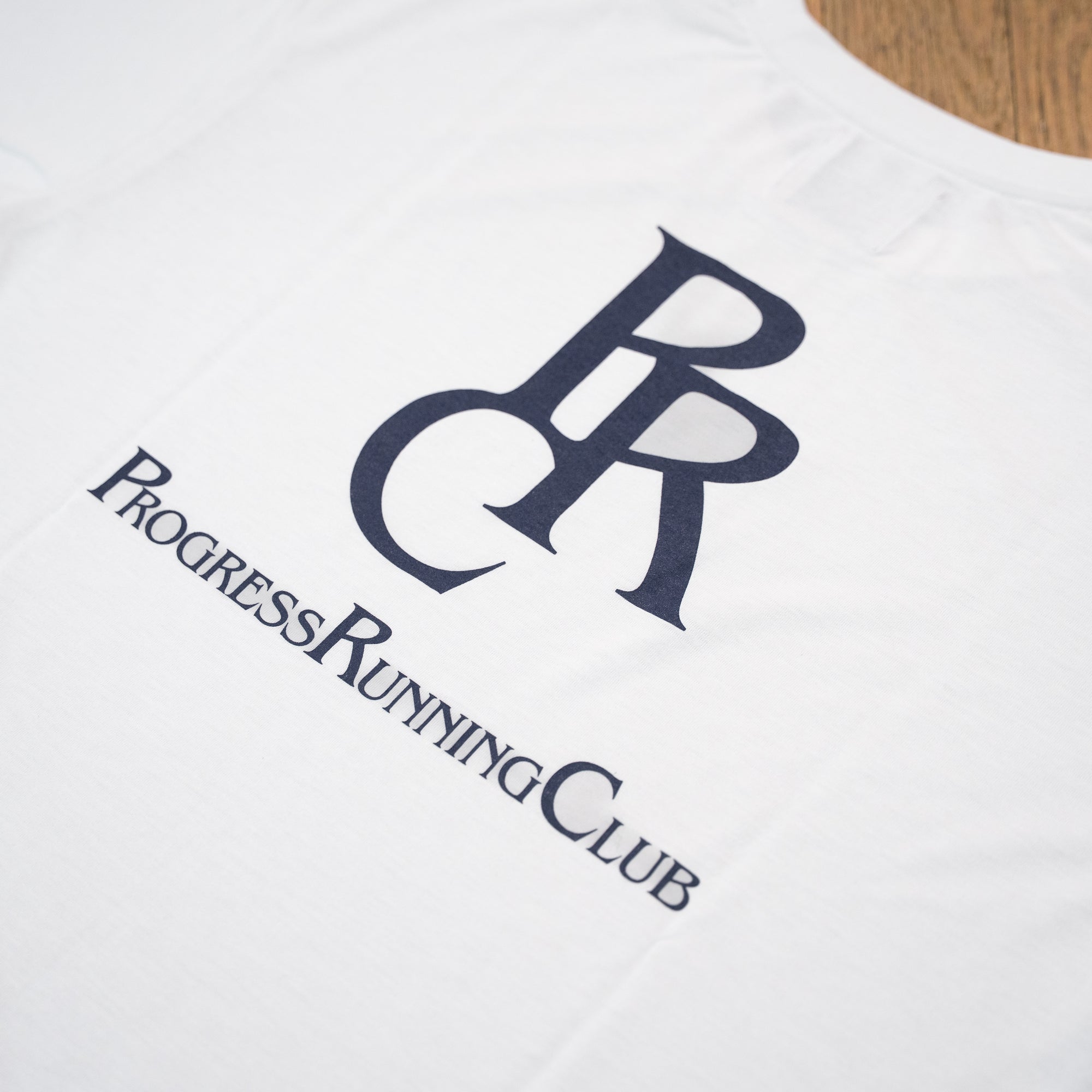 Runtrip × PROGRESS RUNNING CLUB "PRC BADGE LOGO" Rt Logo Tee