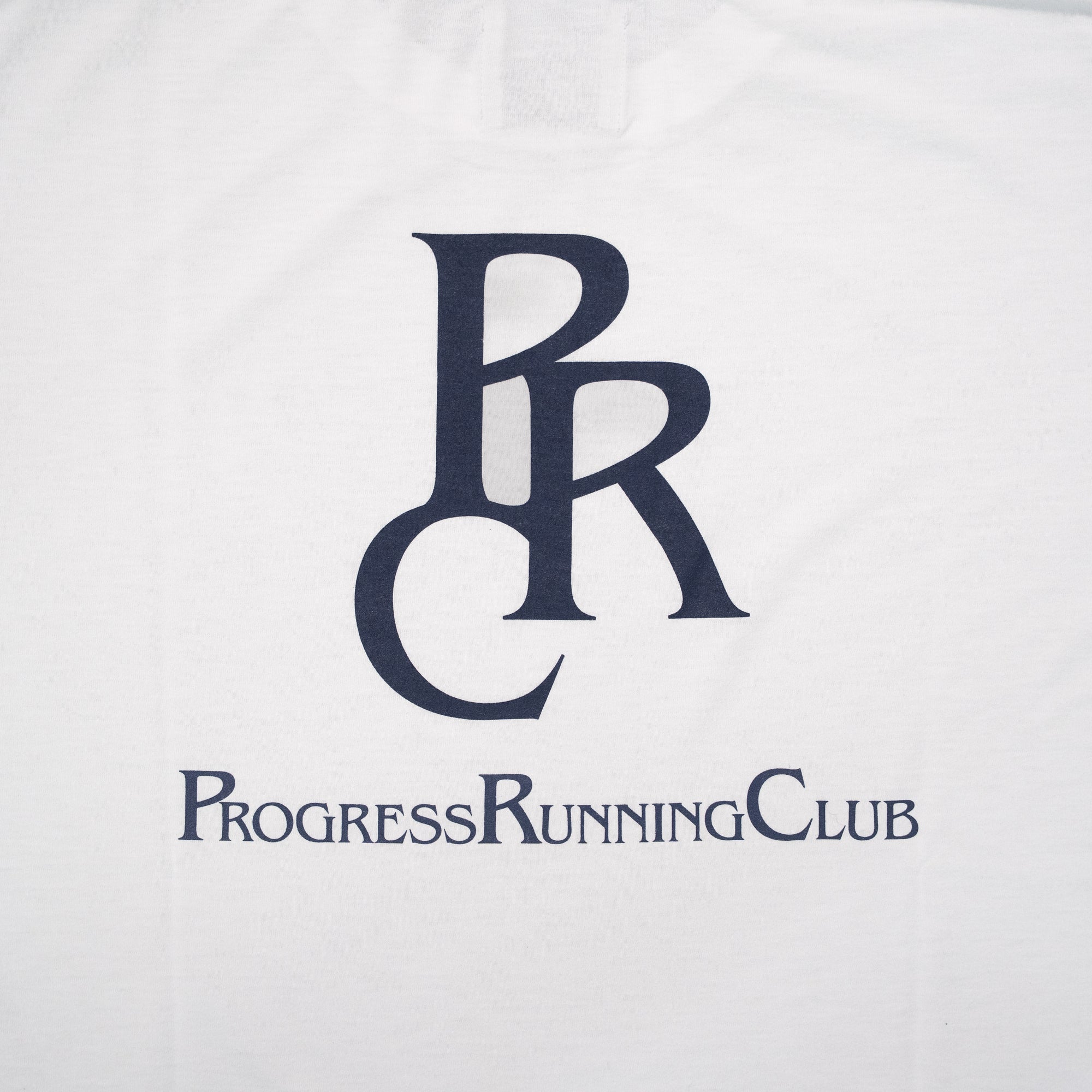 Runtrip × PROGRESS RUNNING CLUB "PRC BADGE LOGO" Rt Logo Tee